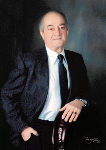 JOHN “CHUCK” STAVROULAKIS